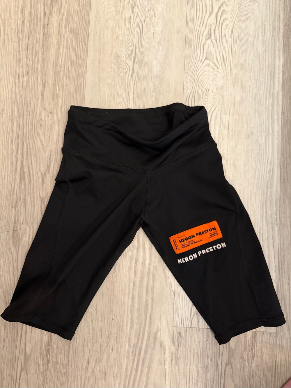 Heron Preston Black Bike Shorts with Orange Logo Patch